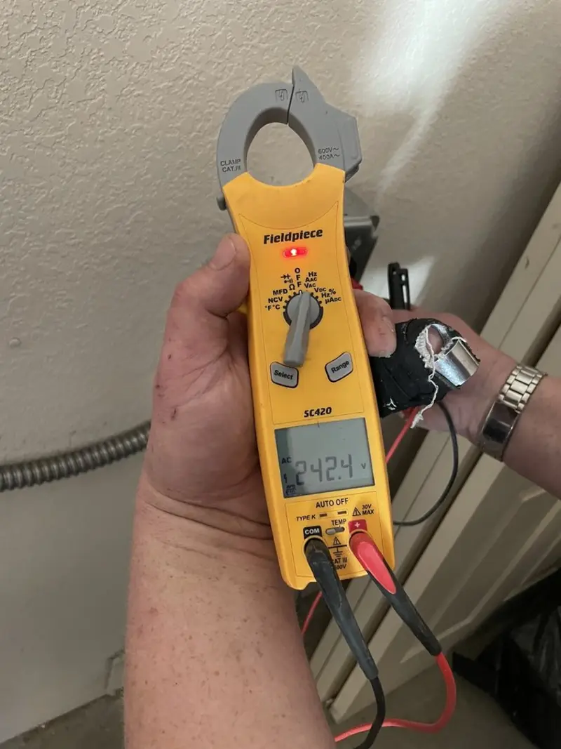 Voltage testing with clamp meter during Whole House Surge Protector in Fort Hood
